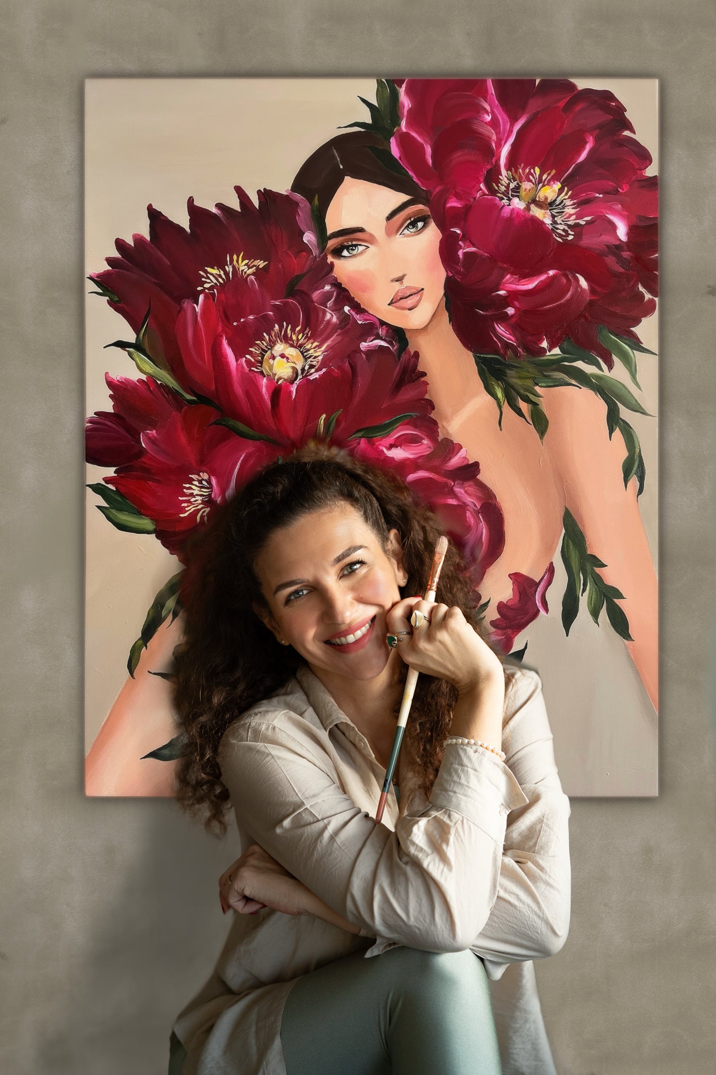 Artist Janka Kykalová with her original painting Carmine Woman