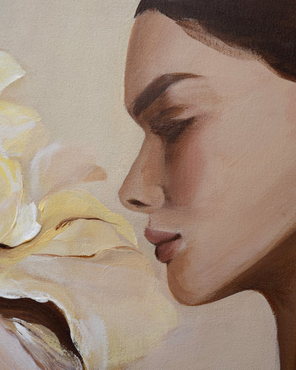 Close-up of the woman's face in Grace by Janka Kykalová, with a lowered gaze beside pale yellow iris petals.
