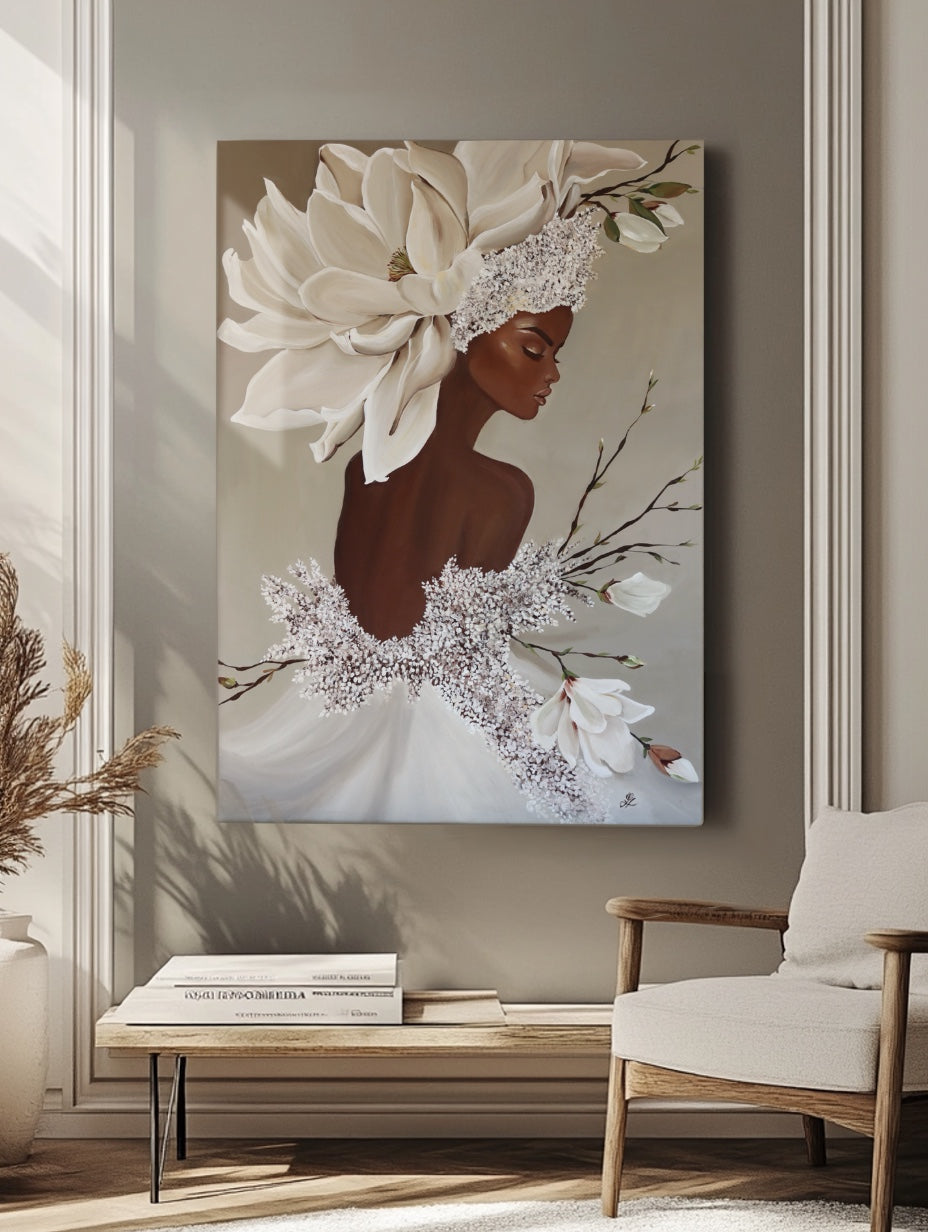 Interior mockup of a large canvas painting featuring a woman with magnolia blossoms, displayed on a taupe wall in a minimalist living room.
