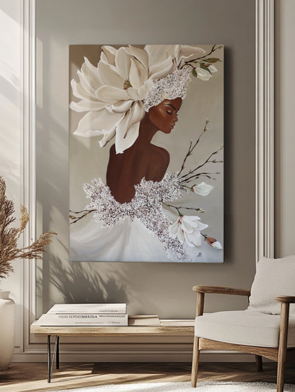 Interior mockup of a large canvas painting featuring a woman with magnolia blossoms, displayed on a taupe wall in a minimalist living room.
